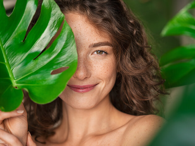 Image of a girl and a tropical leaf, illustrating a story about the Body Shop