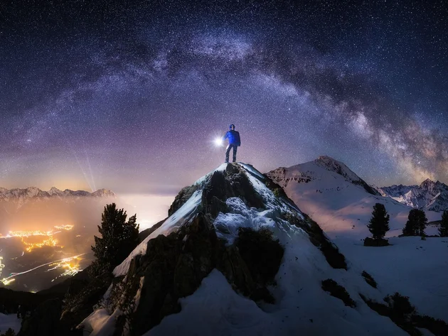 Man on top of a mountain